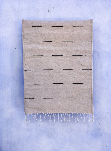 Handwoven Dash natural wool rug, made in Oaxaca Mexico.
