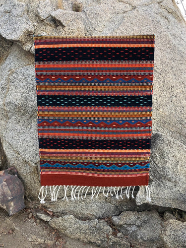 natural wool rug made by hand by Oaxaca artists in Mexico.